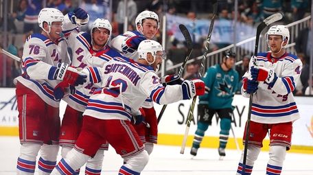 The Rangers' Kevin Shattenkirk is congratulated after scoring
