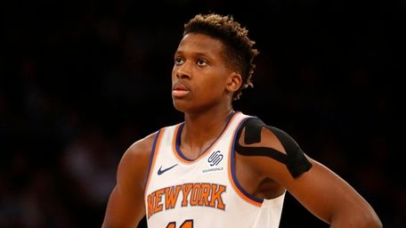 Frank Ntilikina of the Knicks looks on against