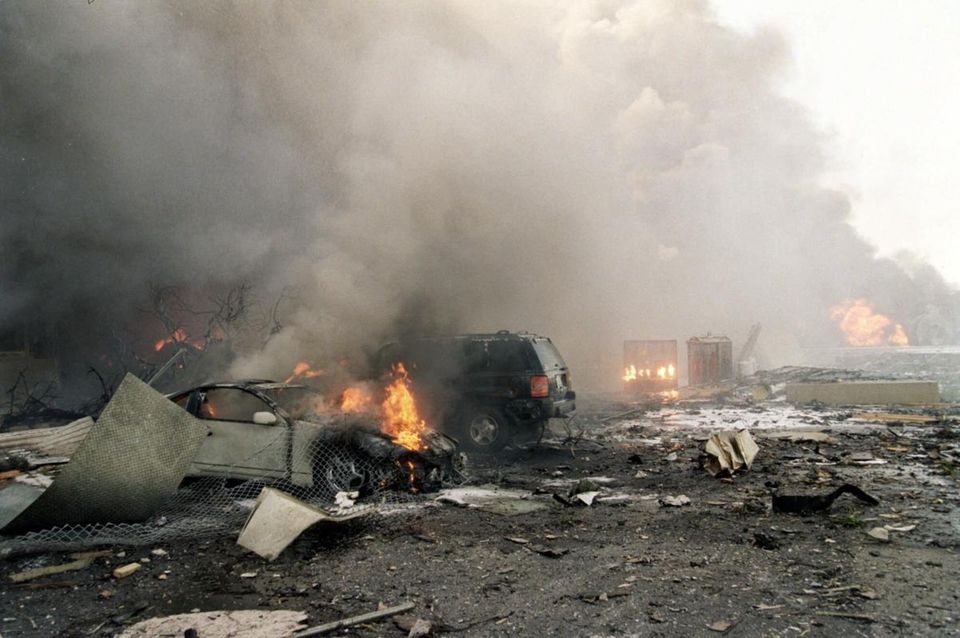 Fires burn amid the rubble outside the Pentagon