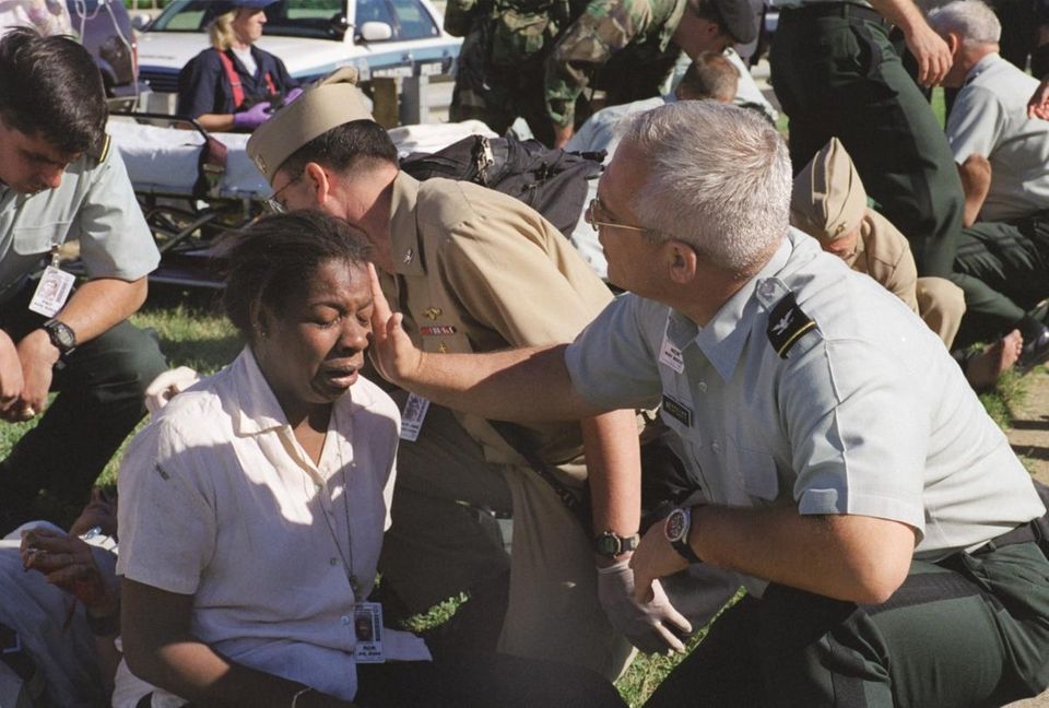 A Pentagon employee is aided outside the building