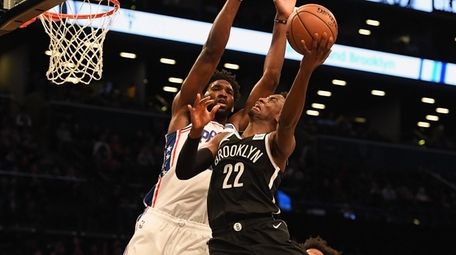 Caris LeVert of the Nets shoots over the