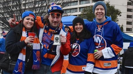 Islanders fans Corinne Rowe, James Fesselmeyer, Kelly Meenan