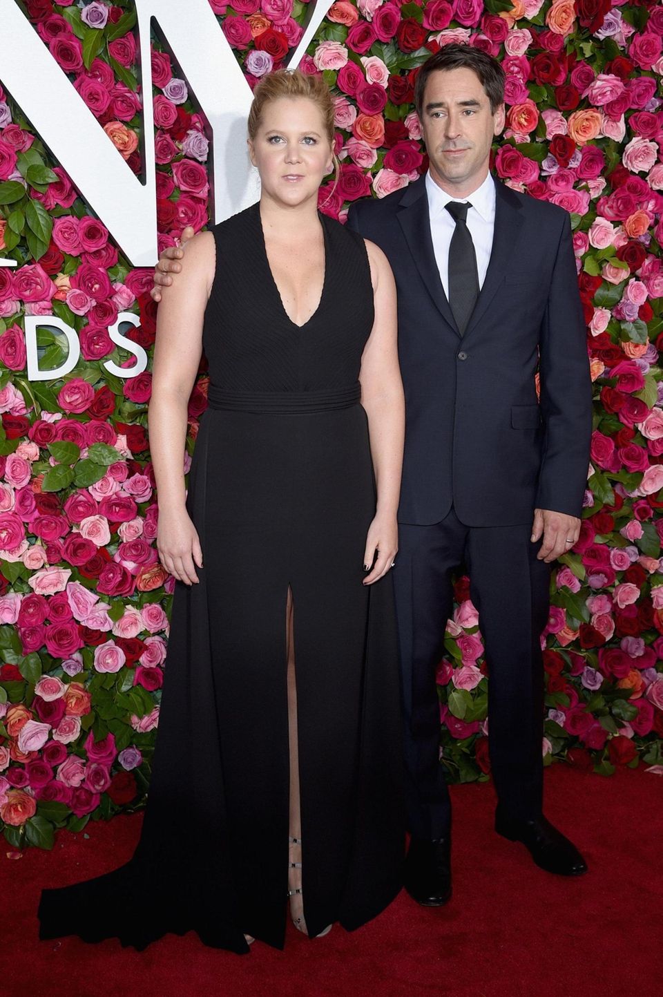 Amy Schumer and husband Chris Fischer attends the