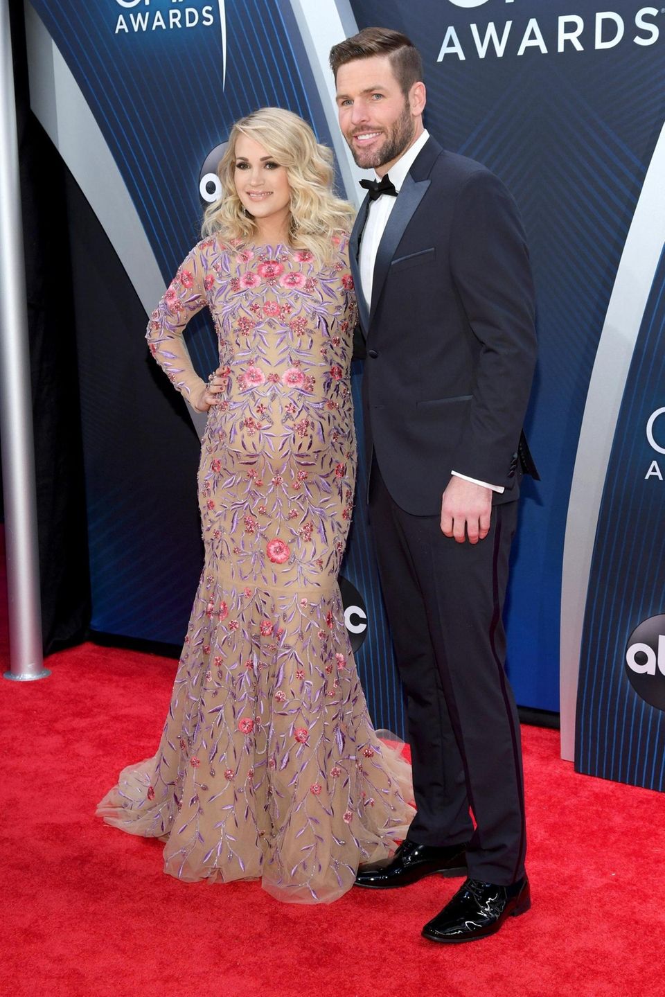 Carrie Underwood and husband Mike Fisher attend the
