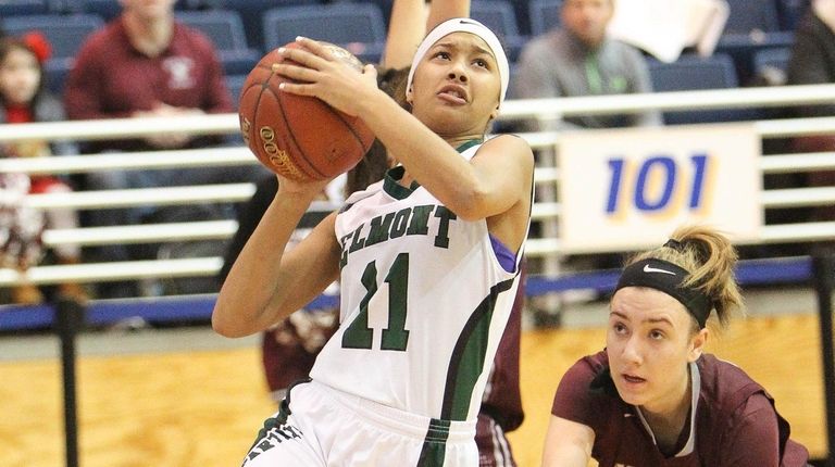 Elmont's Gigi Faison (11) puts one up while