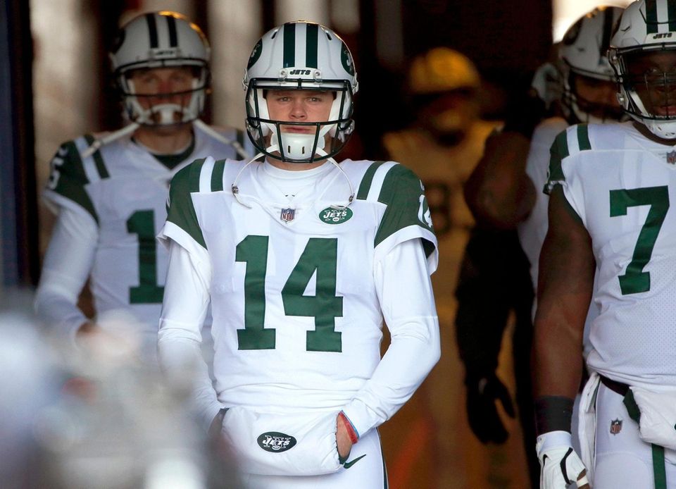 New York Jets quarterback Sam Darnold walks down