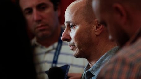 Yankees general manager Brian Cashman speaks to reporters