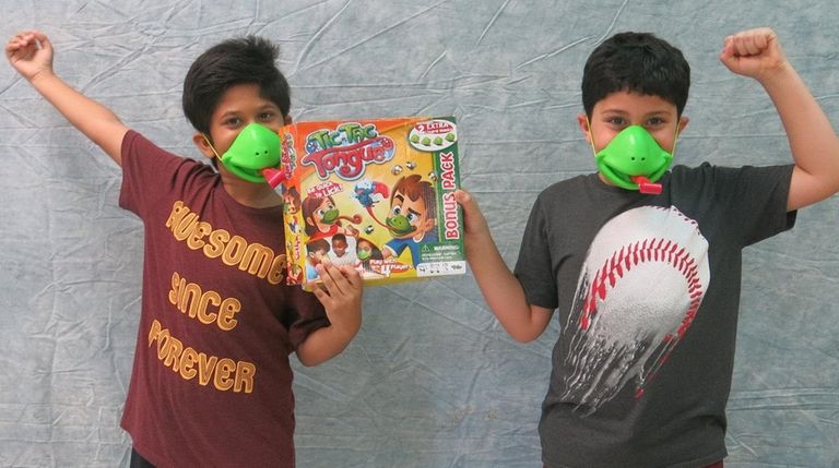 Kidsday reporters Arik Alif, left, and Muzammil Fayaz