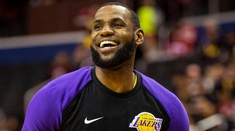 Lakers forward LeBron James warms up before a