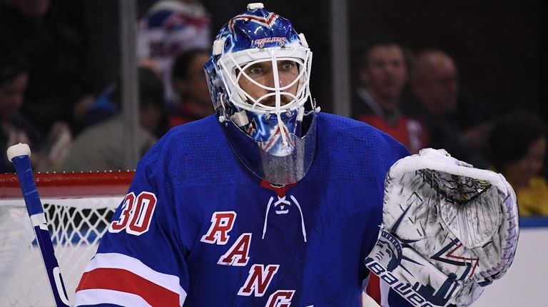 Rangers goalie Henrik Lundqvist defends the net against