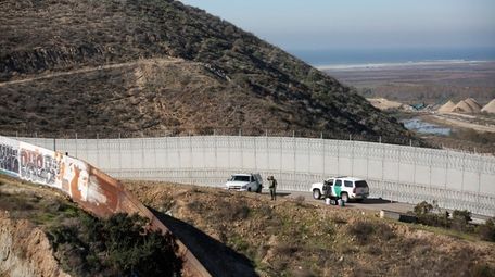 Honduran asylum seekers are taken into custody by