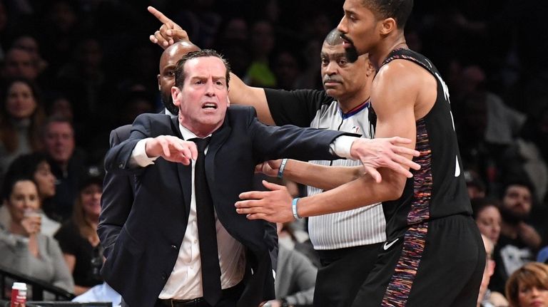Nets guard Spencer Dinwiddie holds back Nets head