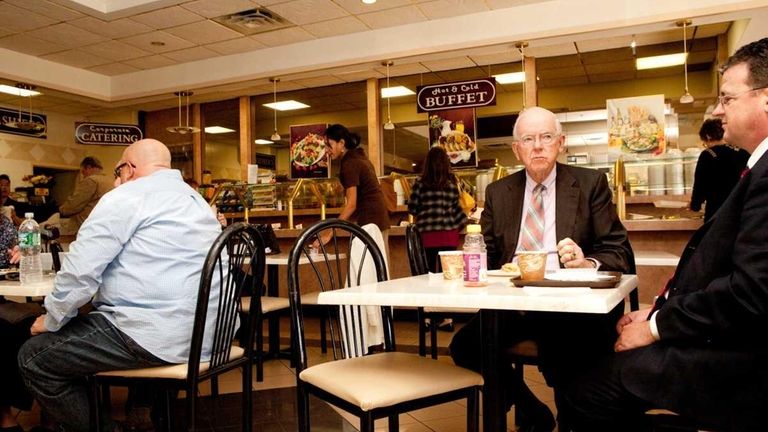 Diners eat lunch at the Benchmark Cafe in