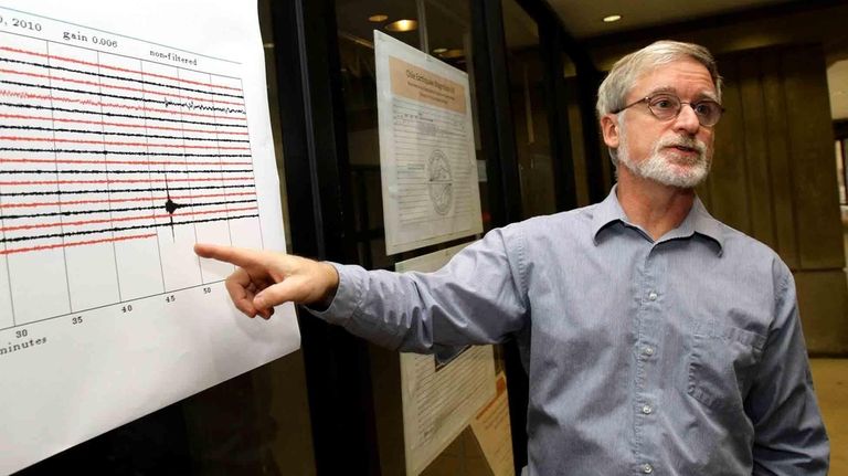 Stony Brook University geology professor Daniel Davis points
