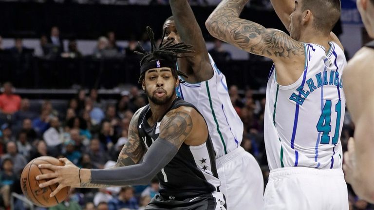 The Nets' D'Angelo Russell, left, who scored 33