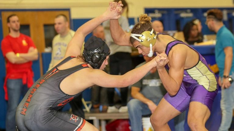 Central Islip's Malachi Lord-Kelly, right, pinned East Islip's