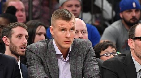 New York Knicks forward Kristaps Porzingis looks on