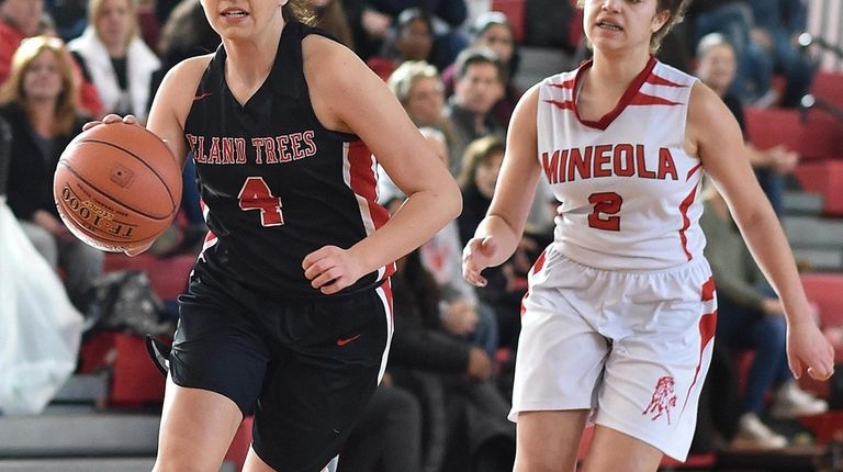 Brianna Fitzgerald #4 of Island Trees, left, races