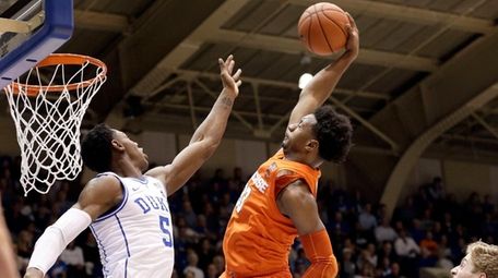 Duke's RJ Barrett (5) and Jack White (41)