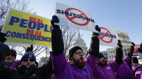 Federal employees rally at the Capitol in Washington