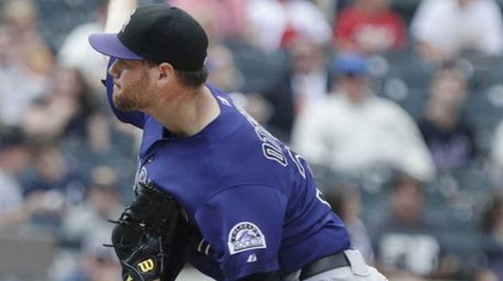 Rockies relief pitcher Adam Ottavino delivers a pitch