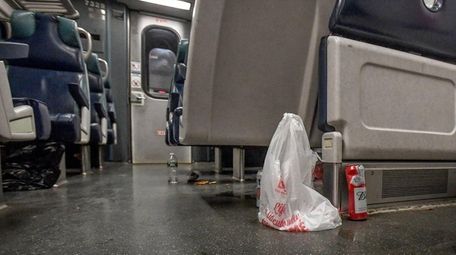 Trash is strewn about the floor and seats
