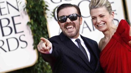 Ricky Gervais and his date arrive at the