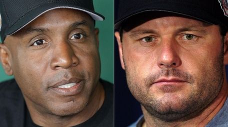 Barry Bonds (L), shown in a 2017 file