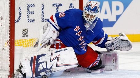 Henrik Lundqvist of the Rangers makes a save