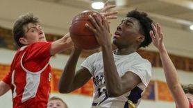 Ahkee Anderson of Greenport goes up for a