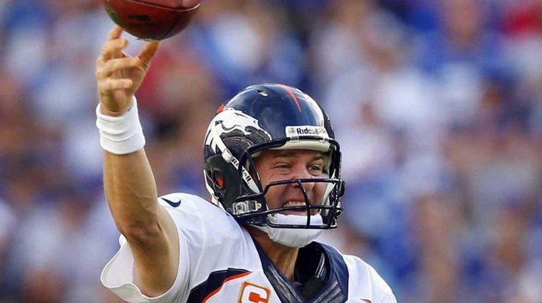 Broncos quarterback Peyton Manning throws a pass in