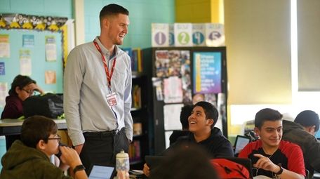 Substitute teacher James Bulva teaches an English classroom