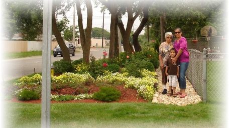 Carmen Arroyo-Santos, Lourdes Velasquez and her son Justin,