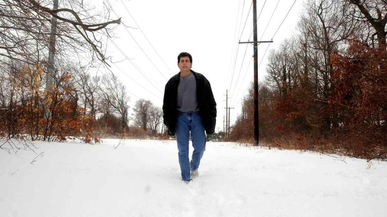 Denis Byrne walks on a hiking trail in