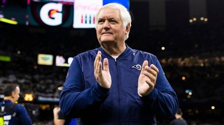 Rams defensive coordinator Wade Phillips claps during the