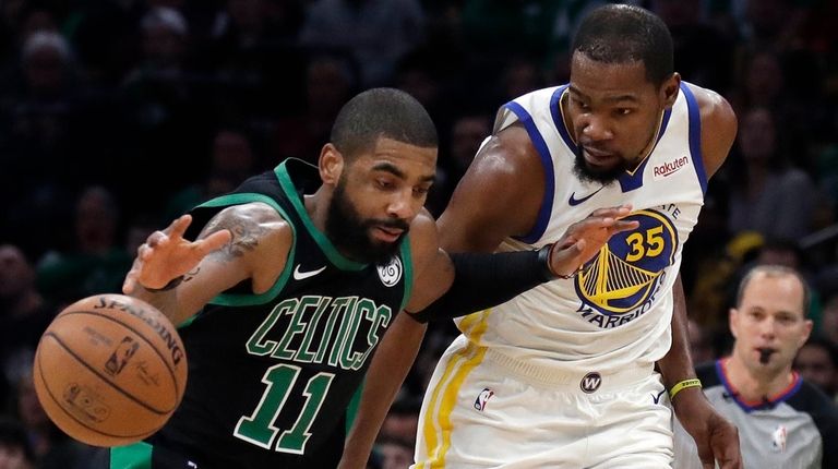 Celtics guard Kyrie Irving dribbles against Warriors