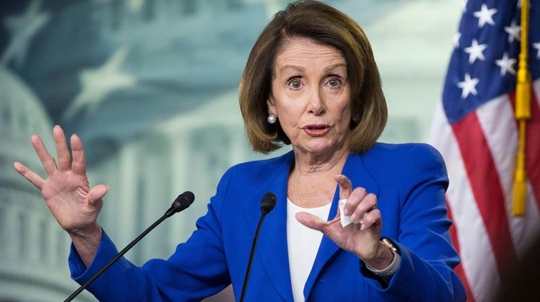 Speaker of the House Nancy Pelosi holds a
