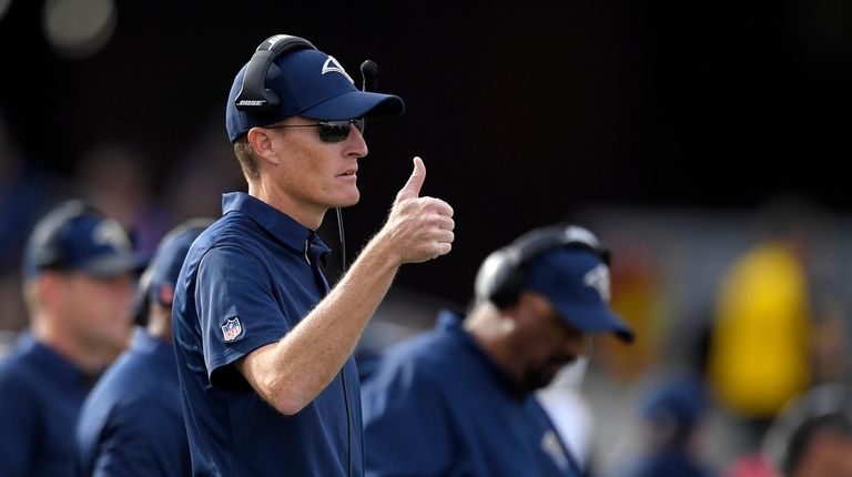 Rams special teams coordinator John Fassel gestures against