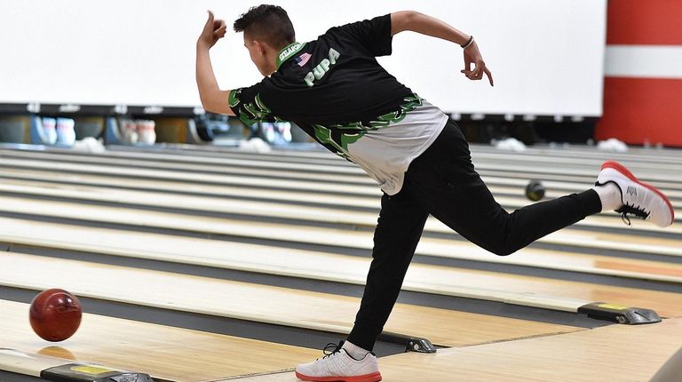 Chris Pupa of Seaford rolls during the Nassau