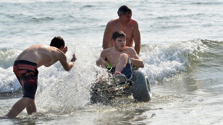 Robert Browne, 17, goes in the water in