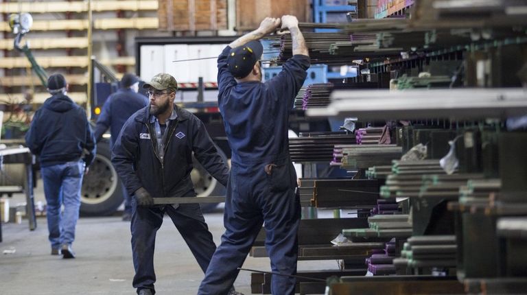 Laborers fill orders of machine grade steel to