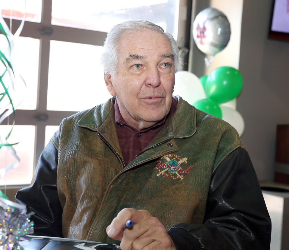 Mets Legend Ed Kranepool signs photos during the