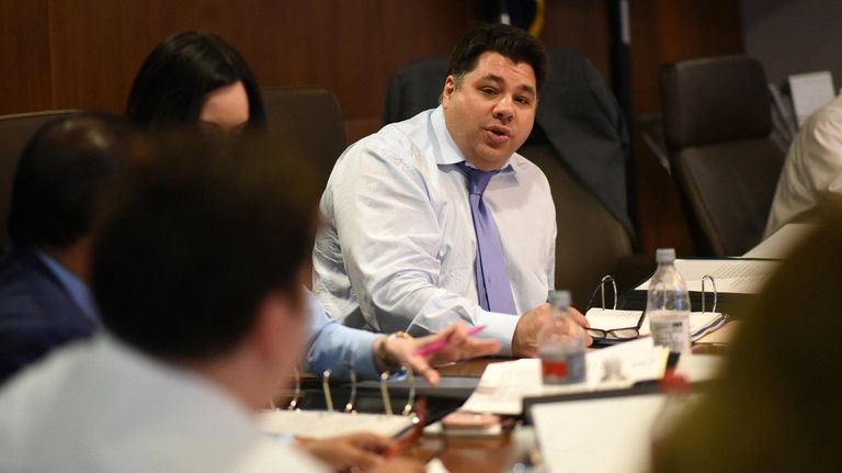 George Tsunis, center, is running Nassau University Medical