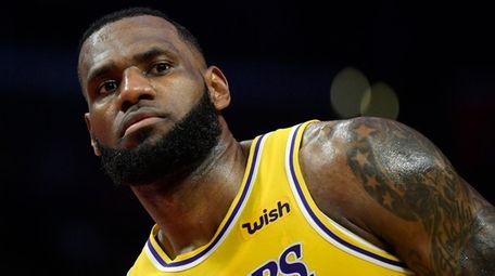 Lakers forward LeBron James stands on the court