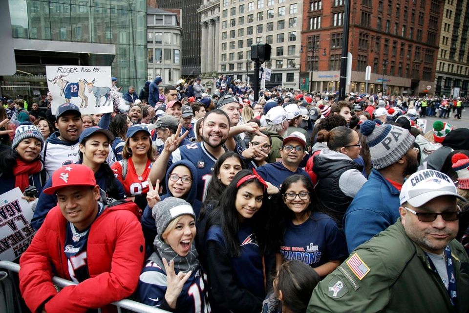 Fans gather near Boston City Hall, Tuesday, Feb.