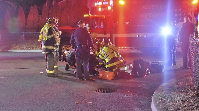 Emergency responders tend to a man struck by