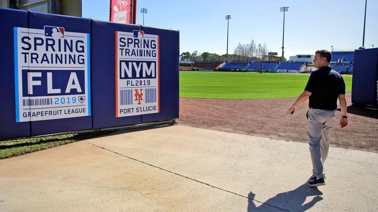 Mets general manager Brodie Van Wagenen walks through