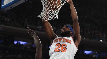 New York Knicks center Mitchell Robinson dunks against