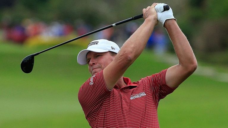 Steve Stricker hits his second shot on the