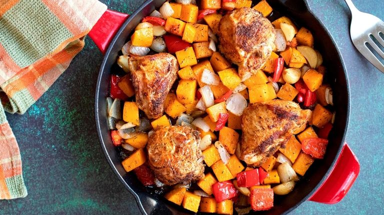 Spice-rubbed chicken thighs are seared and oven-roasted with
